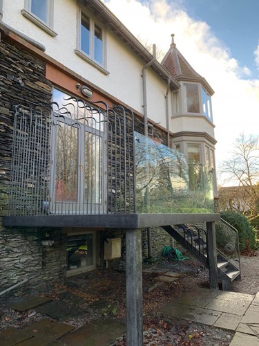 Bespoke balcony with forged railing by CB Arts Ltd